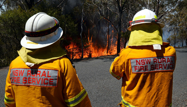 Firefighters monitor a back burn near Mount Victoria in the Blue Mountains on Monday.