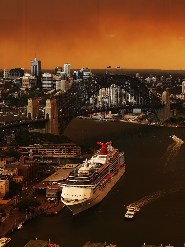SYDNEY, AUSTRALIA - OCTOBER 17: A general view of Sydney harbour shrouded in smoke haze on October 17, 2013 in Sydney, Australia. Sydney is shrouded in a haze of smoke as bushfires rage in the western Sydney suburbs of Springwood, Winmalee and Lithgow. (Photo by Brendon Thorne/Getty Images)