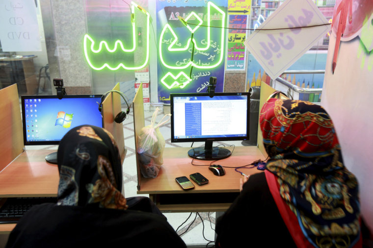 Two Iranian women surf the Internet at a cafe in Tehran, Iran, in September, when authorities briefly lifted blocks on social networks and then restored them.