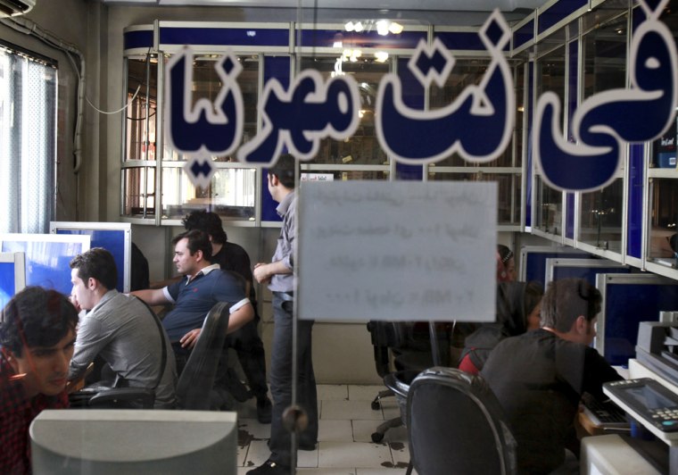 Iranians surf the Internet at a cafe in Tehran, Iran, on Sept, 17, 2013. The joy of Iran's Facebook and Twitter fans was short-lived as authorities restored blocks on social networks after filters were lifted for several hours overnight. The brief access was a