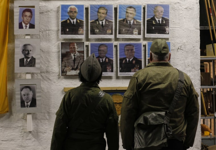 Kalashnikov assault rifles, hand grenades, decontamination showers and oxygen supplies are on display in the bunker, along with old photos of East German military figures.