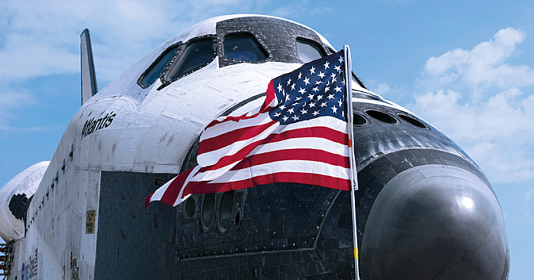 Draped in the Stars and Stripes, Atlantis rests on the runway in July 2011, bringing an end to the space shuttle program. Atlantis is now on display at Kennedy Space Center in Florida.