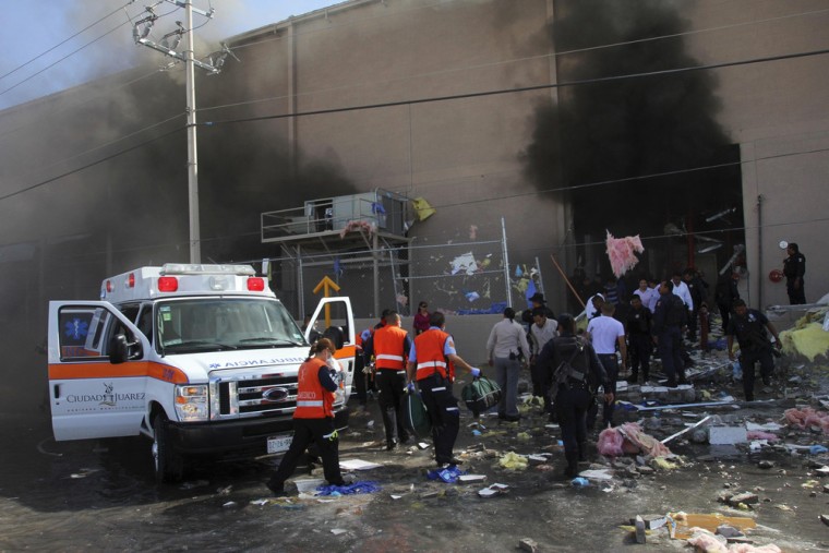 An ambulance parks outside a candy factory after a boiler exploded in the northern Mexican city of Ciudad Juarez.