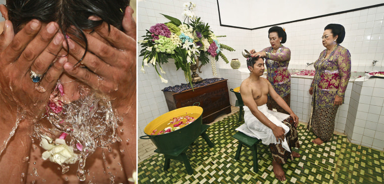 KPH Notonegoro’s family joins in to cleanse him as part of the ‘Siraman’ bathing ritual, done before the formal wedding vows take place.