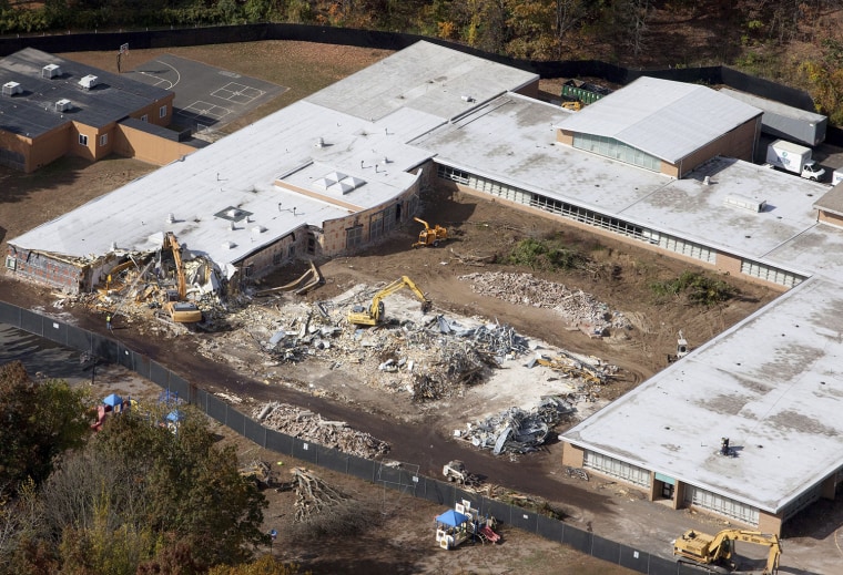Demolition work is underway at Sandy Hook Elementary School in Newtown, Conn., Oct. 25, 2013.