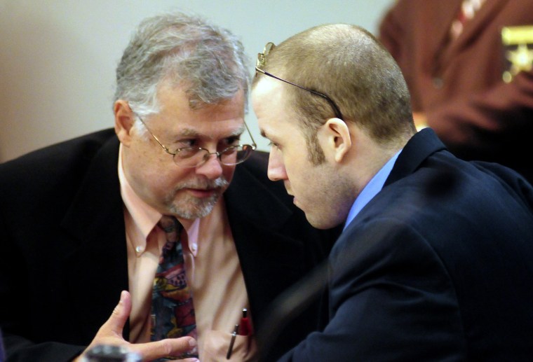 Jerry Word of the Office of the Georgia Capital Defender, left, talks to Guy Heinze, Jr. in court, Thursday.