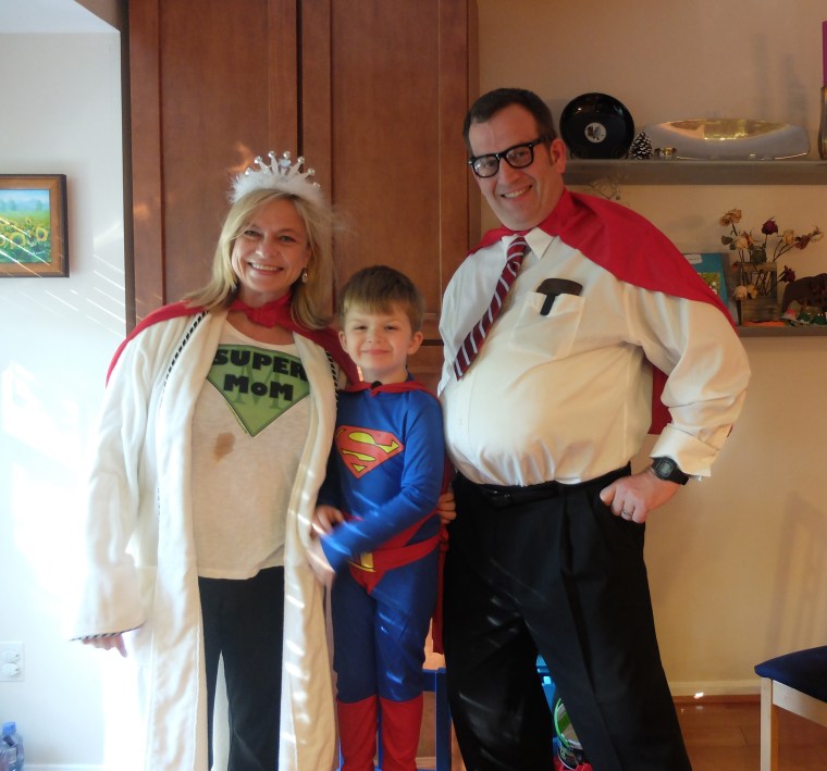 4-year-old Tucker Campbell is Superman, flanked by Supermom Kristi and Superdad Robert