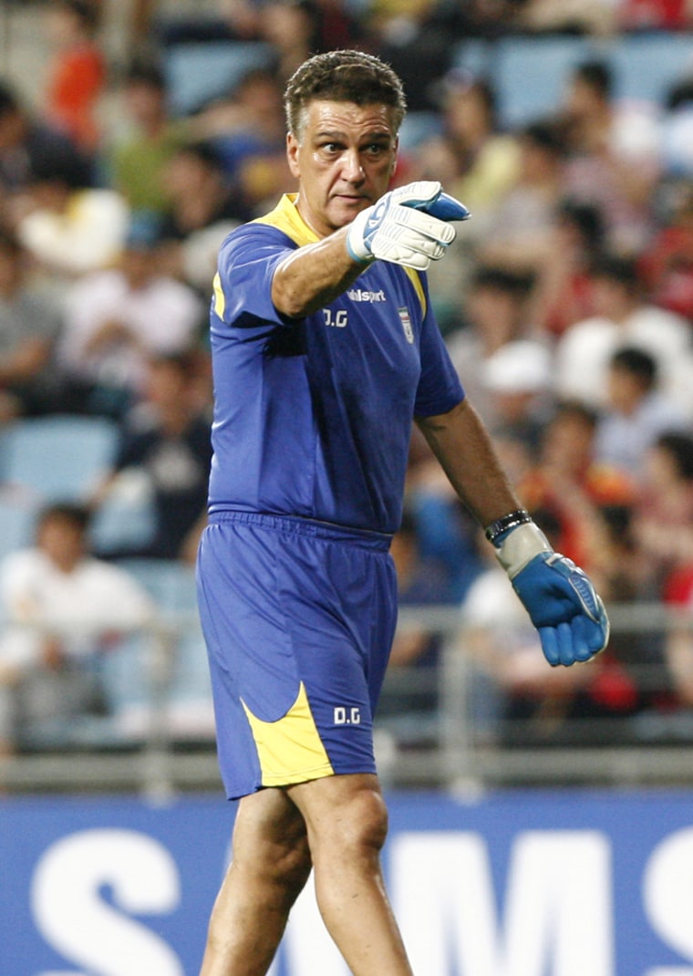 Goalkeeping coach Dan Gaspar leads a pre-game warm-up for the Iran national soccer team.