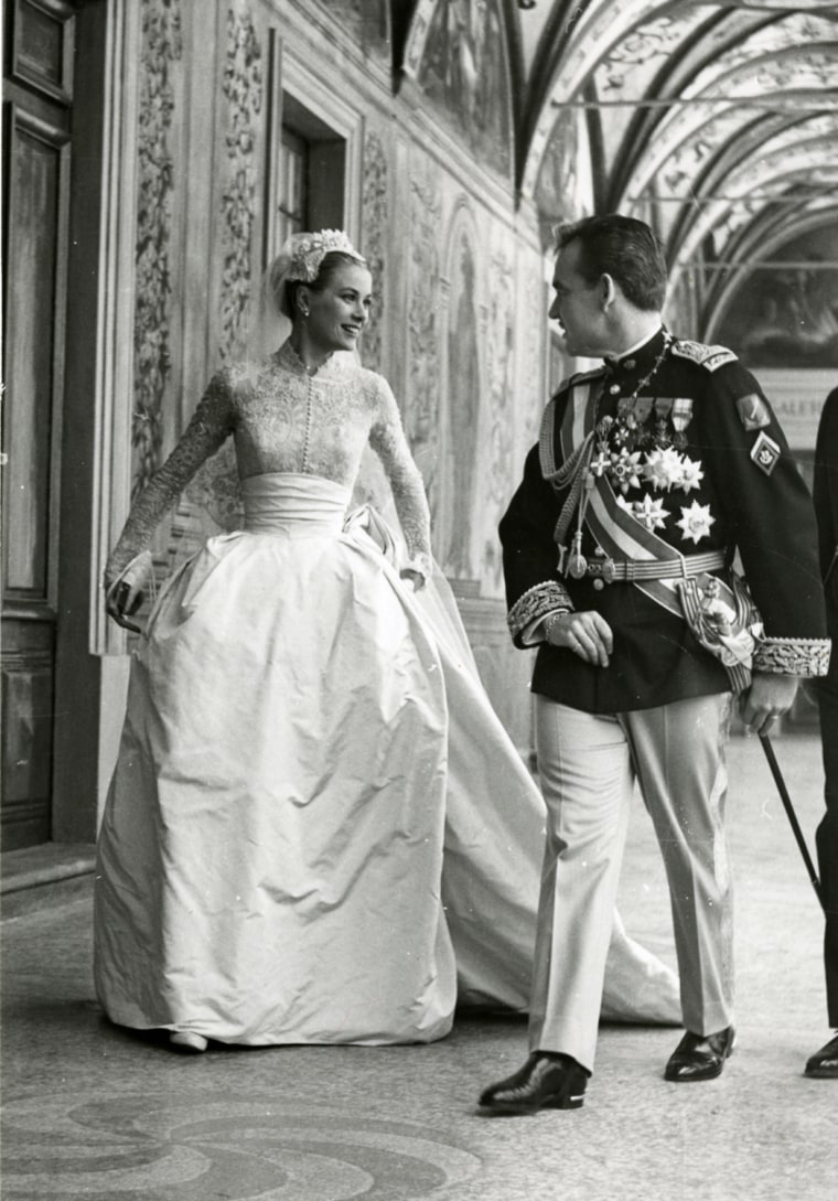Prince Rainier III and Princess Grace in the Gallery of Hercules in the Princely Palace of Monaco, following the official
exchange of their marriage v...