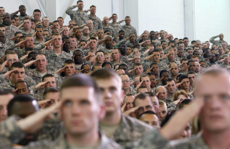 Military personnel salute during the Pledge of Allegiance prior to President Barack Obama's address to military personnel who have recently returned from Afghanistan, Friday, May 6, 2011, at Fort Campbell, Ky.