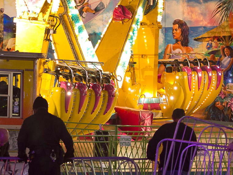 Fairgrounds police secure a barricade around one of two rides called the Vortex after an accident closed the ride Thursday the North Carolina State Fair in Raleigh.