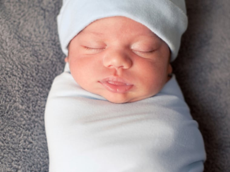 Close Up of Swaddled Newborn Baby Sleeping Peacefully