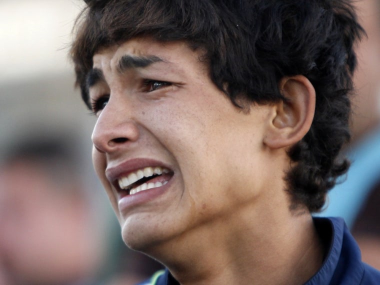 A boy cries during the funeral of his relative, who was killed in a bomb attack outside a cafe in Baghdad's Amil district on Oct. 20, 2013.