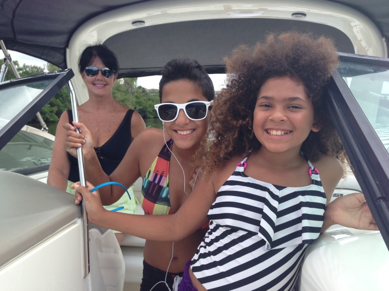 Jessica Seldin's two daughters enjoy a boat ride with their grandmother, Seldin's mom.