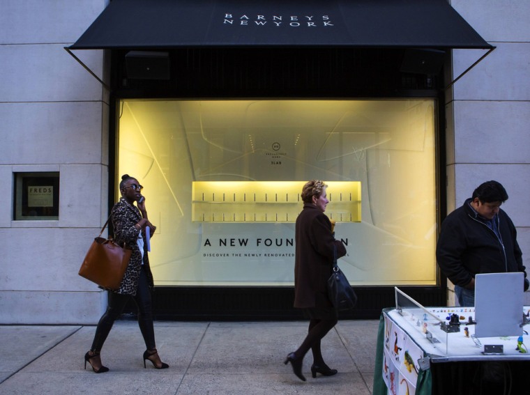 People walk by a Barneys New York retail store in New York October 24, 2013. A civil rights organization on Thursday demanded a meeting with the CEO ...