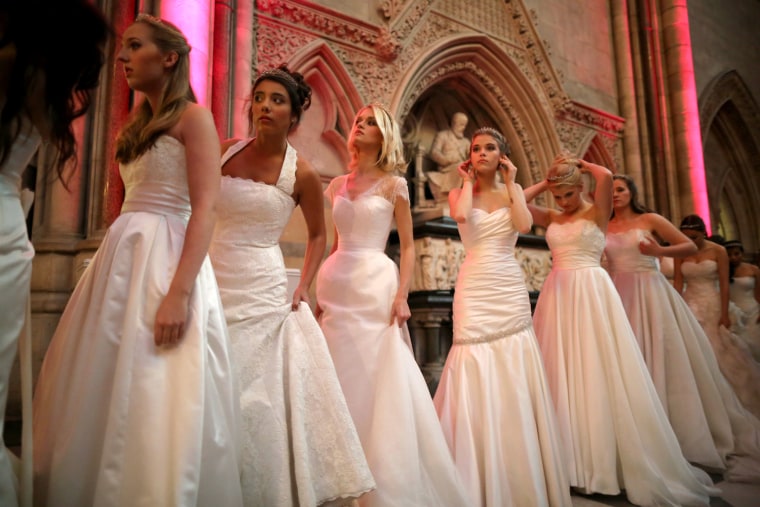 Debutantes wait nervously in line to be presented to guests during the Queen Charlotte's Ball at the Royal Courts of Justice on Oct. 26, 2013 in London.
