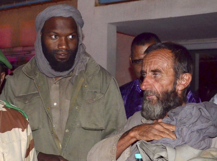 Former hostages Thierry Dol (left) and Daniel Larribe (right) are pictured at Niamey's airport on Tuesday after their release.