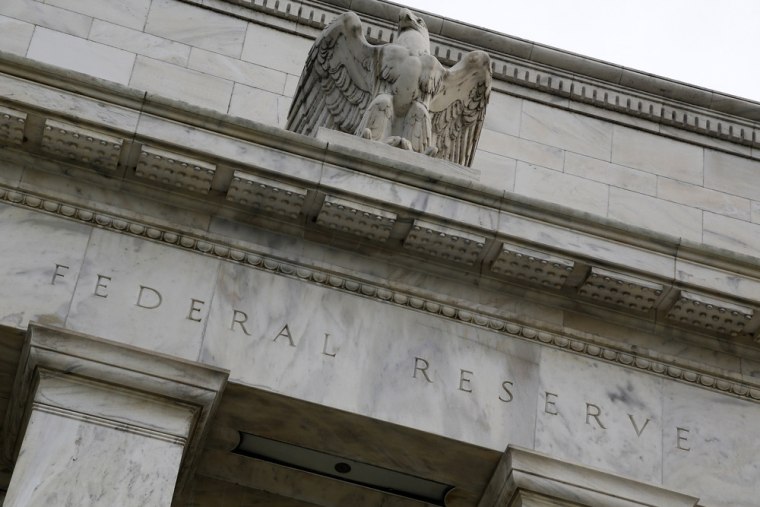 An eagle tops the U.S. Federal Reserve building's facade in Washington, in this July 31, 2013, file photo.