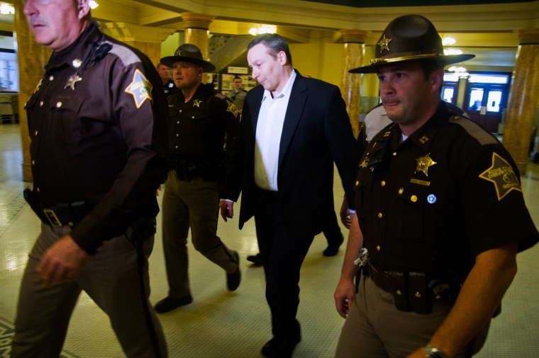 Former Indiana state trooper David Camm, center, walks out of the Boone County Courthouse in Lebanon, Ind., as a free man Thursday, Oct. 24.