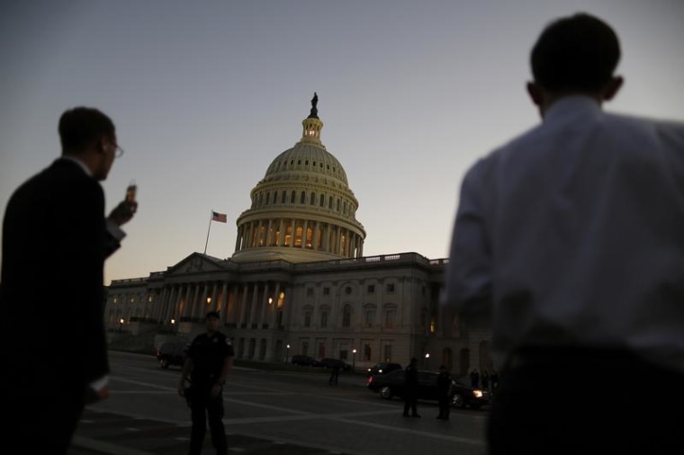 Night falls over the U.S. Capitol Dome.