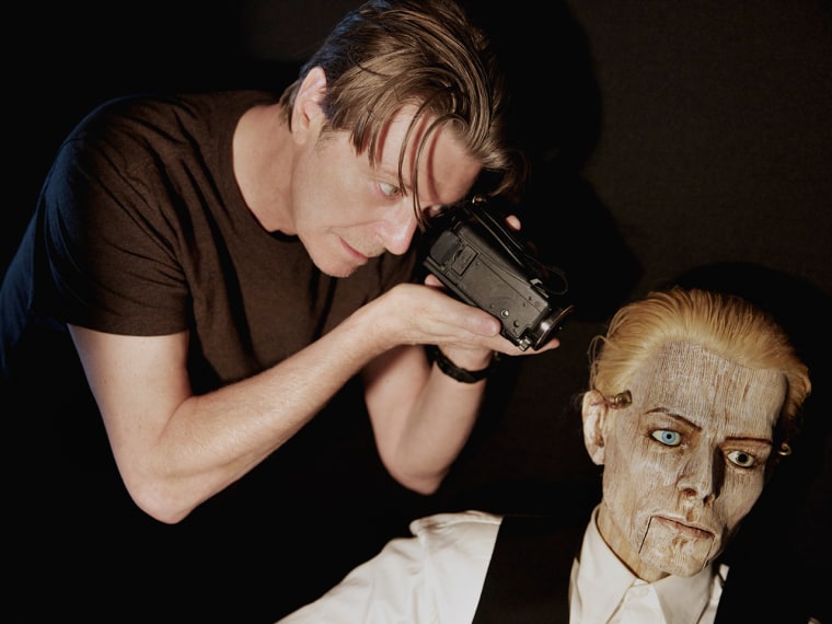 David Bowie on camera, filming David Bowie the wooden puppet.