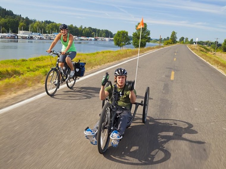 Seth McBride, 30, and his partner, Kelly Schwan, 32, pictured here on Sauvie Island, Oregon, have embarked on a yearlong, 10,000-mile ride from Portland, Ore., to Argentina.