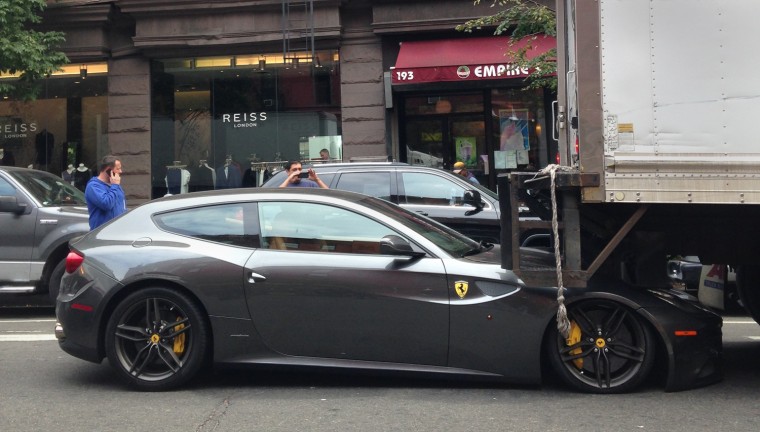 A ferrari is crushed by a truck on Oct. 31, 2013 in New York City.