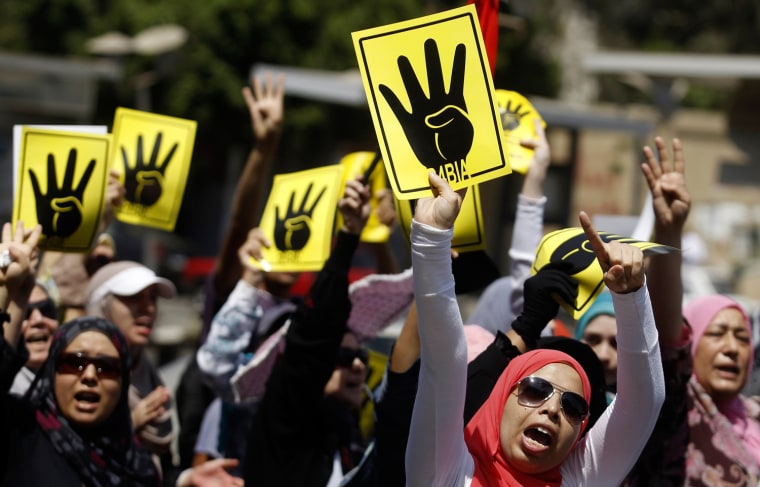 Members of the Muslim Brotherhood and supporters of ousted Egyptian President Mohamed Morsi shout slogans against the military at a protest, Friday.