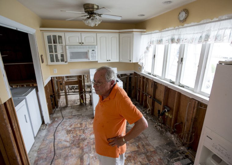 Jack Thompson stands in his Toms River home, which would need to be elevated to comply with new FEMA rules.