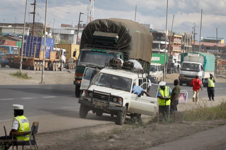 Police stop a car at a vehicle checkpoint in Nairobi, Kenya, in 2012. Minibus drivers worried that new traffic laws, which carried higher fines and bigger jail sentences, would result in higher bribes.