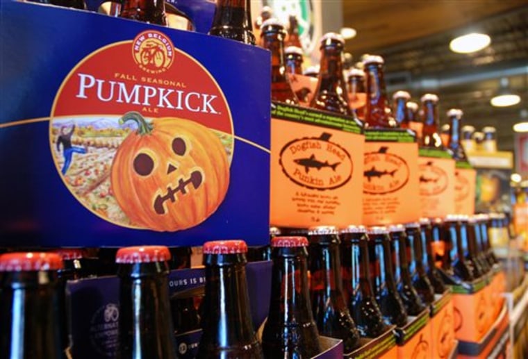 This Friday, Aug. 30, 2013 photo shows pumpkin beers on display for sale at a Whole Foods Market in Richmond, Va. Labor Day may be considered the uno...