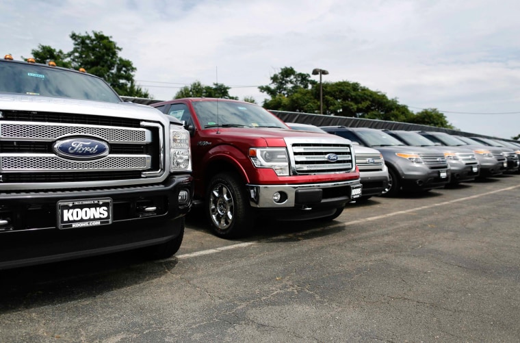 New Ford vehicles occupy the lot at Koons Ford dealership in Fairfax, Virginia, in this July 24, 2013 file photo. U.S. auto sales to individual U.S. c...
