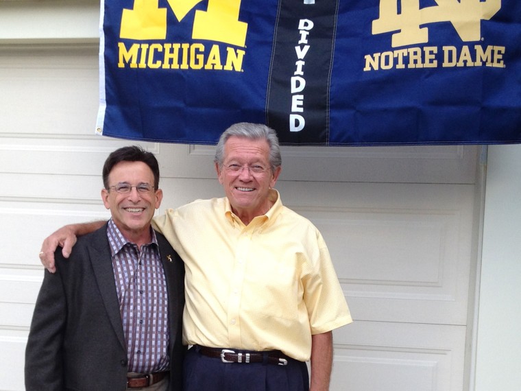 Leo Staudacher, a fellow who had a heart attack two years at a UofM/Notre Dame football game. It's taken with the man who performed CPR and saved Stau...