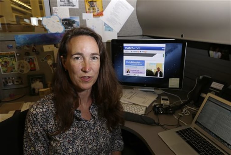 Lynn Boyden, an information architect in web services at the University of Southern California, poses with a dating website on her computer at the USC...