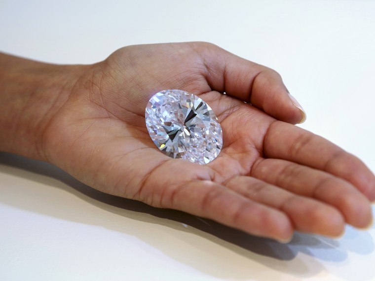 A 118-carat white diamond is on display at Sotheby's, a New York auction house, Wednesday, Sept. 4, 2013 in New York. The oval stone will be auctioned...