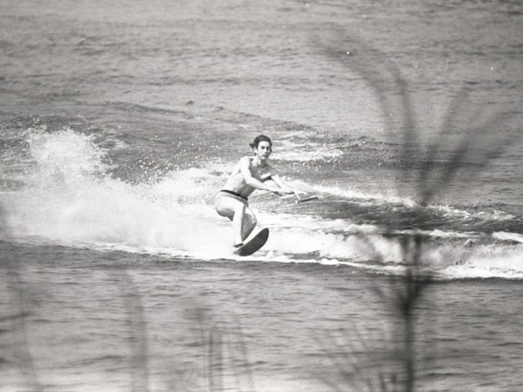 Prince Charles waterskiing on a chair in Sunninghill Park in 1970.