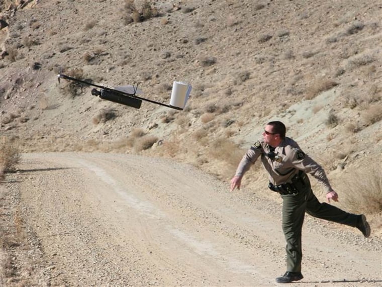 Deputy Danny Norris of the Mesa County Sheriff's Office in Colorado, launching a Falcon drone off his shoulder during a test run. It is illegal to damage the property of the sheriff's office — and that would include shooting down its drones.
