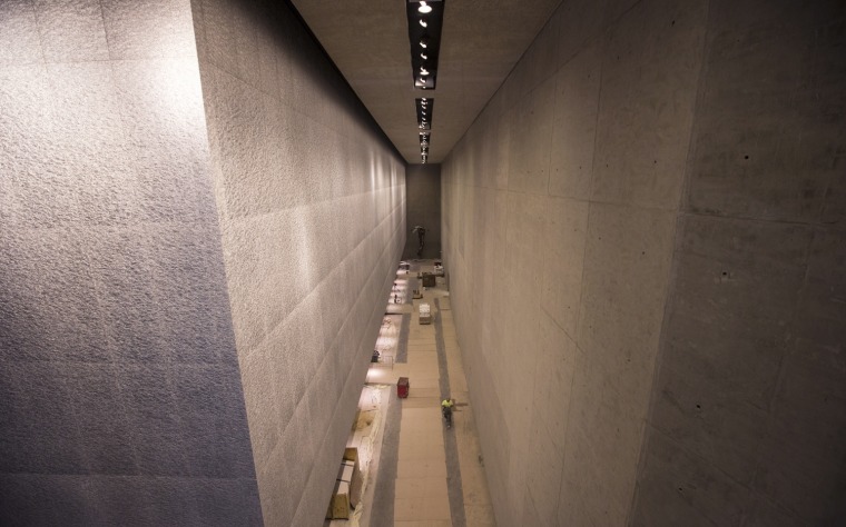 The underside of the South Pool (left) appears to float above the exhibit hall.