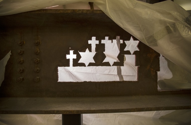 These religious symbols, cut from steel from the site, were given to victims' family members.