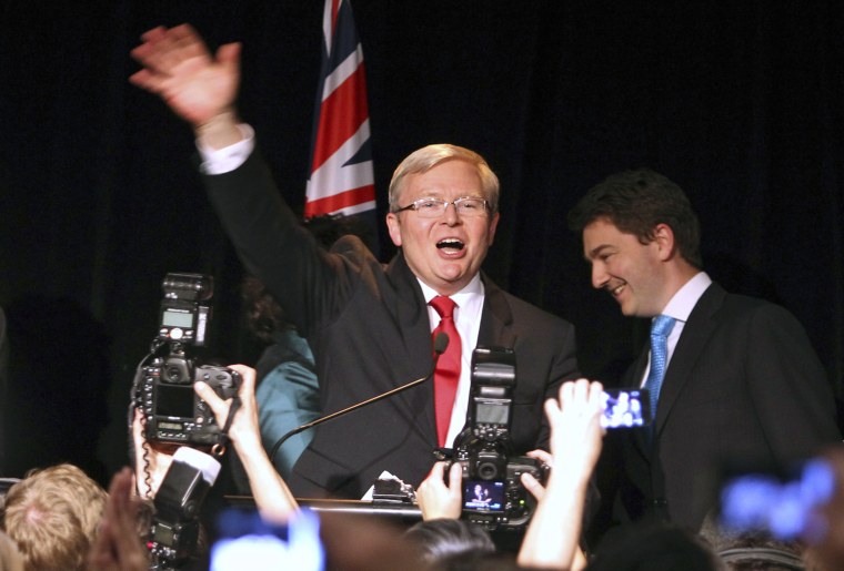 Defeated Australian Prime Minister Kevin Rudd waves to supporters at a Labor Party function in Brisbane on Saturday.
