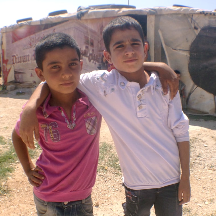 Mahmoud, left, and Ibrahim Haradawi, right, were best friends growing up on the streets in Aleppo's outskirts. Today they are even closer friends living next to each other in makeshift tents in Lebanon. They said war will never separate them and insisted their families live in Syria together.