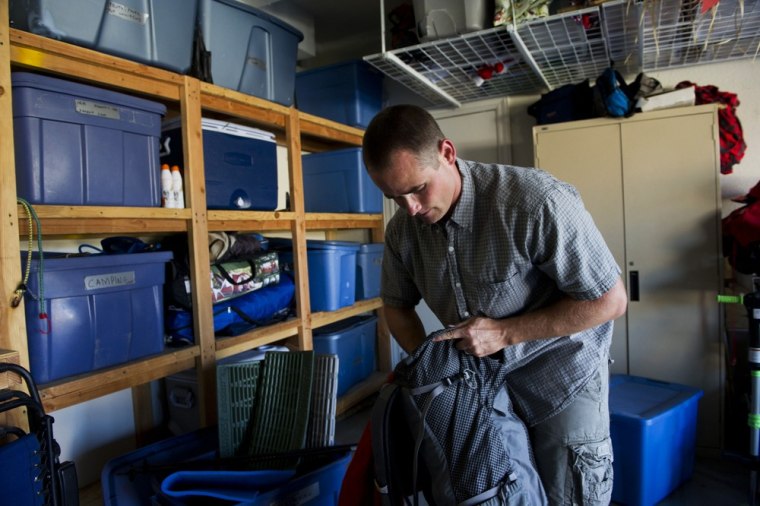 Jonathan Pickens goes through his camping gear at his home in Roseville, California, Thursday, September 5, 2013.