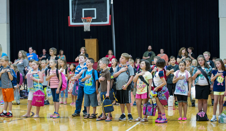 Burgin Independant students in Burgin, KY., recite the Pledge of Allegiance of the United States Thursday, Aug. 1, 2013.