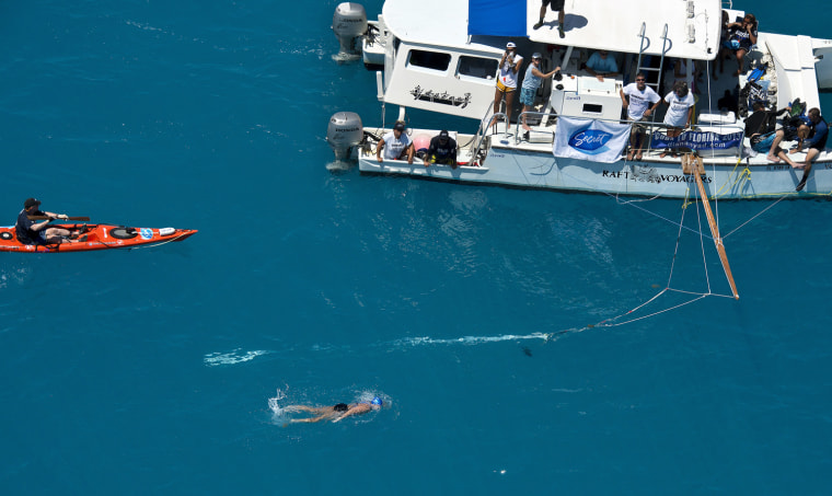 In this photo provided by the Florida Keys News Bureau, Diana Nyad swims in her attempt to go from Cuba to Florida September 2, 2013 less than two miles off Key West, Florida.