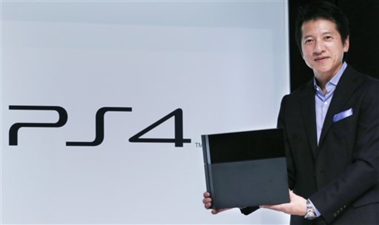 Hiroshi Kawano, Sony Corp.'s chief of the game business in Japan and Asia, holds a PlayStation 4 during an event in Tokyo, Monday, Sept. 9, 2013. Sony...