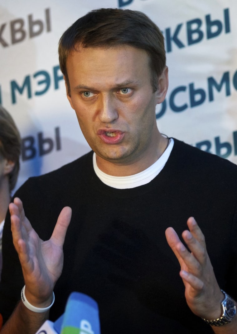 Russian opposition leader Alexei Navalny gestures as he speaks to the media at his headquarters in Moscow on Sunday.