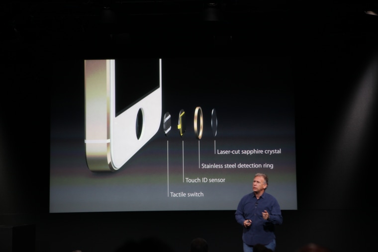 Apple's Phil Schiller shows off the innards of the Touch ID system on the iPhone 5S.