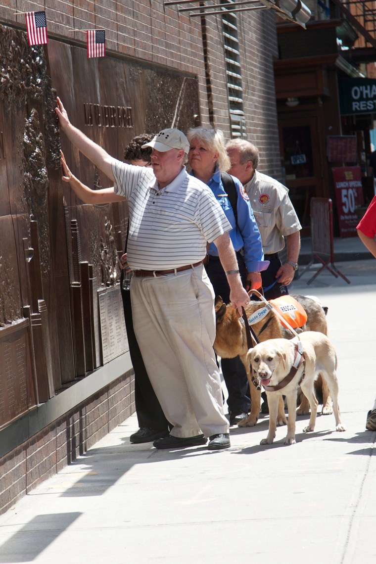 Image: Michael Hingson with dogs.