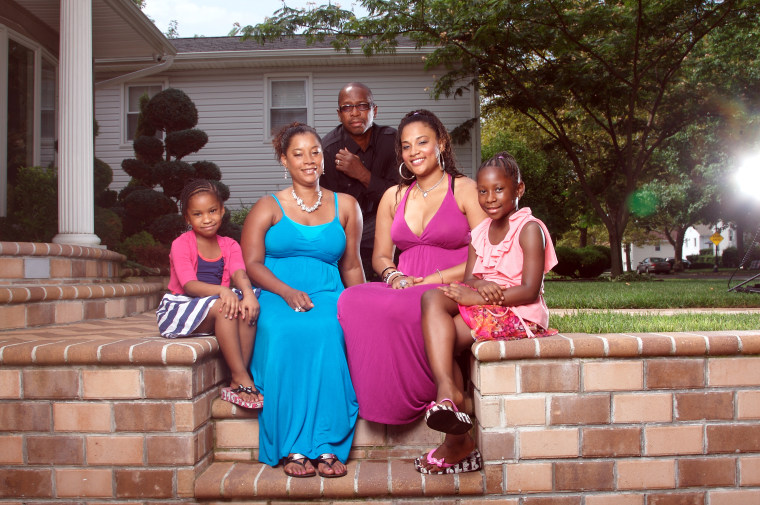 Genelle Guzman-McMillan August 07, 2011 was the last person to be pulled alive from the World Trade Center rubble In Manhattan New York.  Pictured here with husband Roger and daughters Kimberly (22) Kaydi (7) and Kellie (5) in their home in Valley Stream, Long island, New York.