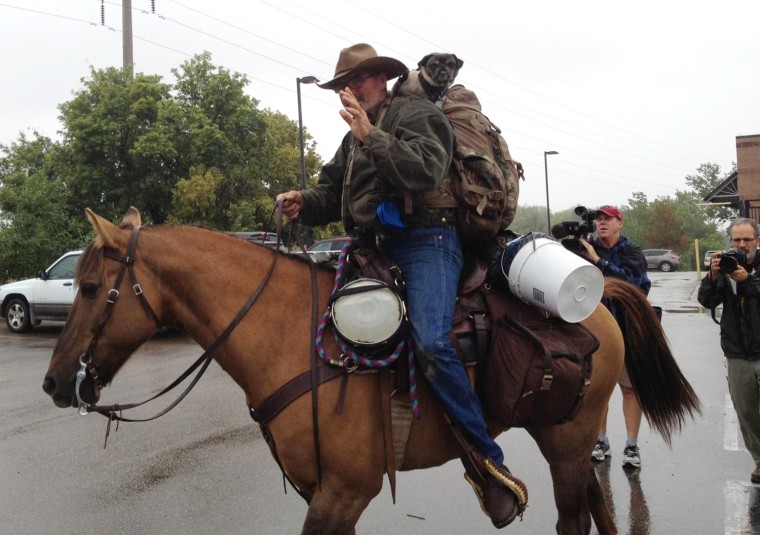 Patrick Schumacher, arrested on suspicion of animal cruelty and riding under the influence, rides away on his horse Dillon on Sept. 10 at the Humane Society of Boulder Valley, after he was released from jail the previous evening.